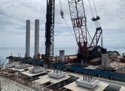 A crane on a construction site

Description automatically generated